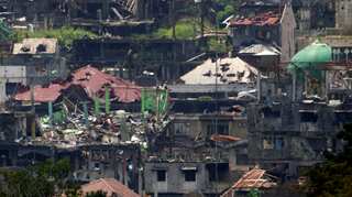 Philippine army says taking fire from women, children in Marawi battle