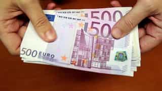 German Elections: Euro, bond drop as Merkel holds on