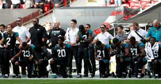 Why the US sports stars are not standing up during the national anthem