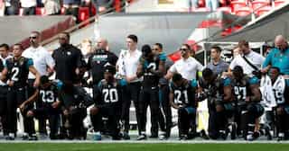 Why the US sports stars are not standing up during the national anthem