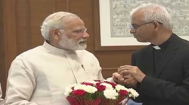 Indian priest rescued from IS captivity arrives in India, meets PM Modi