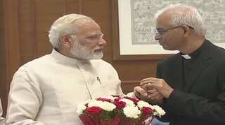 Indian priest rescued from IS captivity arrives in India, meets PM Modi