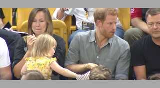 WATCH: Cute girl quietly eats Prince Harry's popcorn