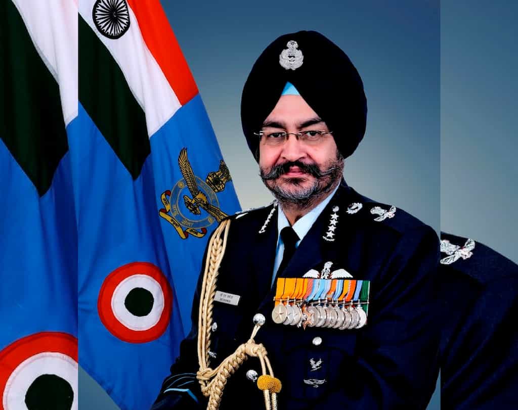 Air Chief B S Dhanoa receives baton of Chairman, COSC from Admiral Sunil Lanba