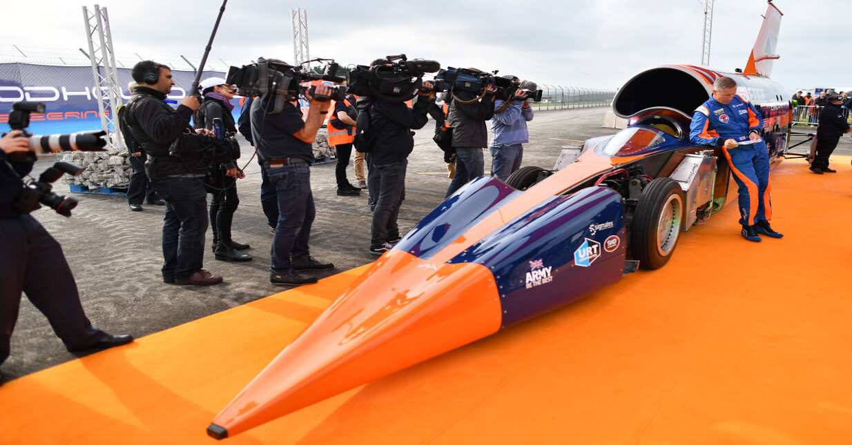 Royal Air Force Wing Commander stands alongside the Bloodhound supersonic car.