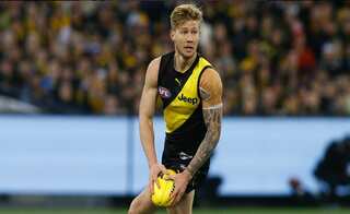 Australian Rules Football: Player banned after topless photo scandal
