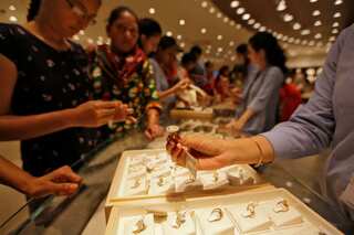 Gold edges higher; Fed statement in focus