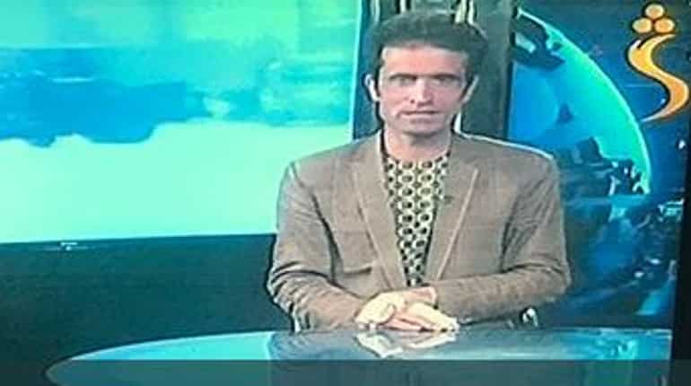 Afghan journalist goes on air moments after attack on his TV station