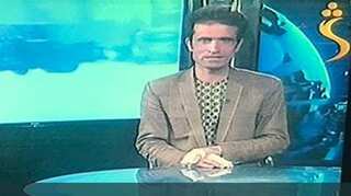 Afghan journalist goes on air moments after attack on his TV station