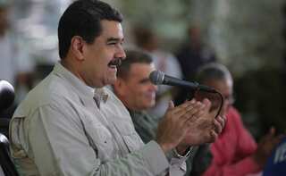 Venezuela's Maduro defies foreign censure, offers 'prize' to voters