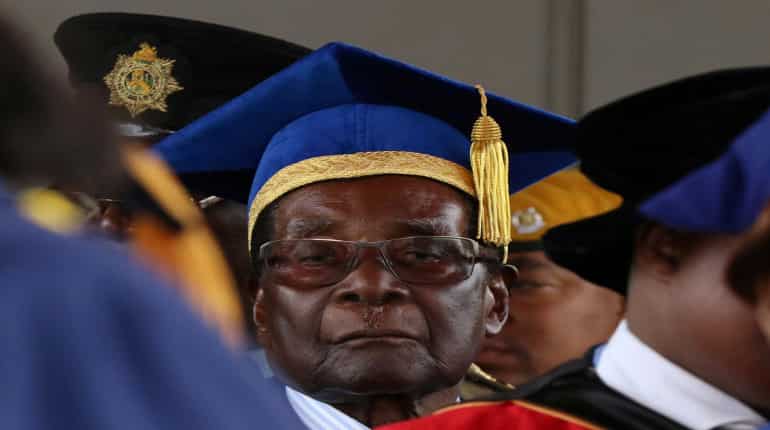 Robert Mugabe defiant amid mounting pressure to step down from his party