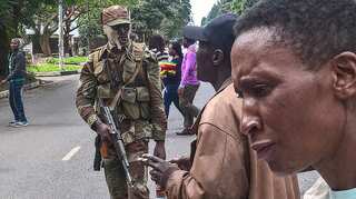 Zimbabwe army stops crowd marching on Mugabe's official home