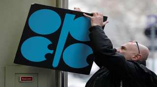 OPEC works on deal to cut output, as Russia plays tough