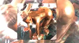 Kim Kardashian poses topless in thong and body glitter