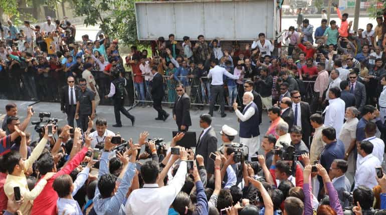 PM Modi walks with inked finger after casting vote, Congress says 'roadshow'