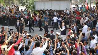 PM Modi walks with inked finger after casting vote, Congress says 'roadshow'