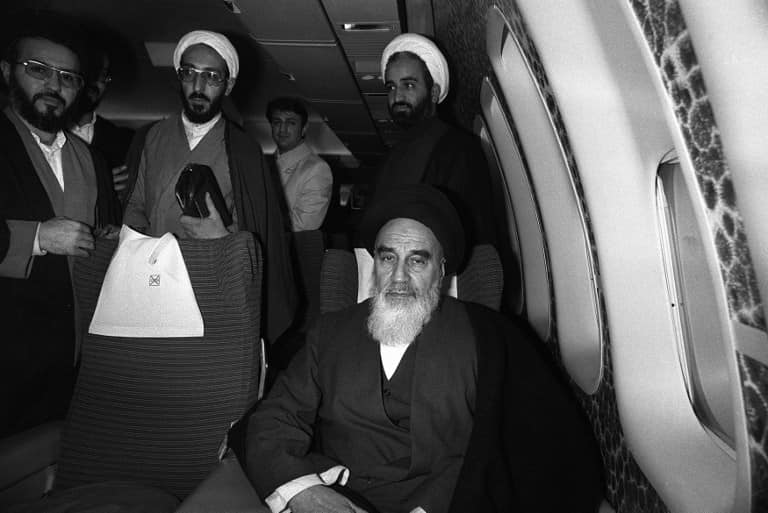 Ayatollah Ruhollah Khomeini posing aboard