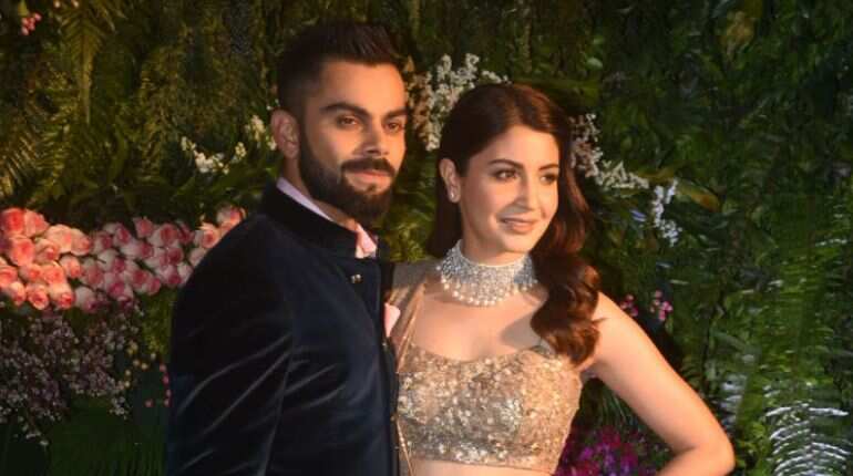 Virat Kohli and Anushka Sharma look regal at their Mumbai reception
