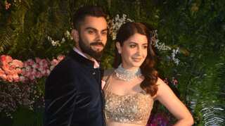 Virat Kohli and Anushka Sharma look regal at their Mumbai reception