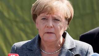 Angela Merkel 'optimistic' in new bid to end political impasse