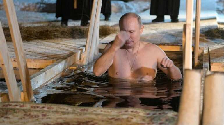 Putin takes dip in icy lake to mark Orthodox Epiphany