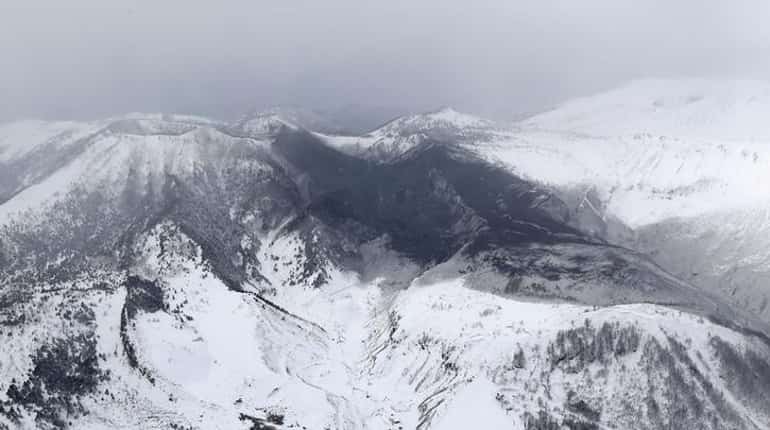 One killed as avalanche engulfs skiers after volcano erupts at Japanese resort