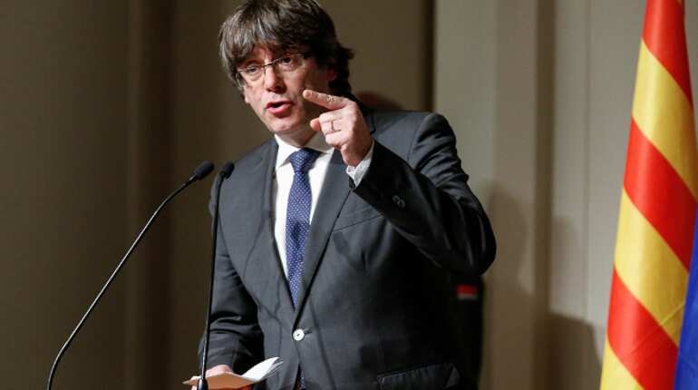 Catalan separatist Puigdemont faces arrest as supporters cheer his return to Spain