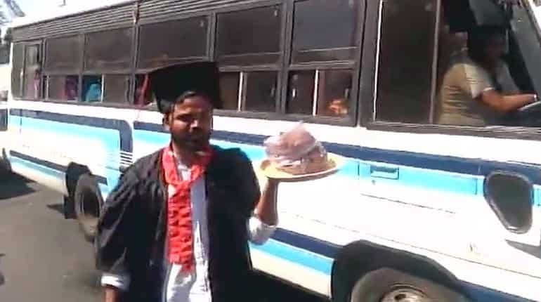 Students donning degree robes sell pakodas near Modi's rally venue