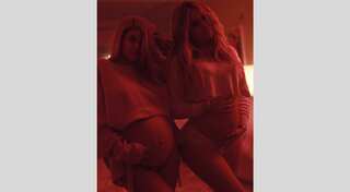 Kylie Jenner, Khloé Kardashian show off baby bumps in rare twinning picture