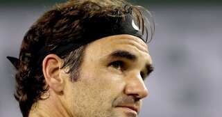 World No. 1 Federer wins rain-delayed match
