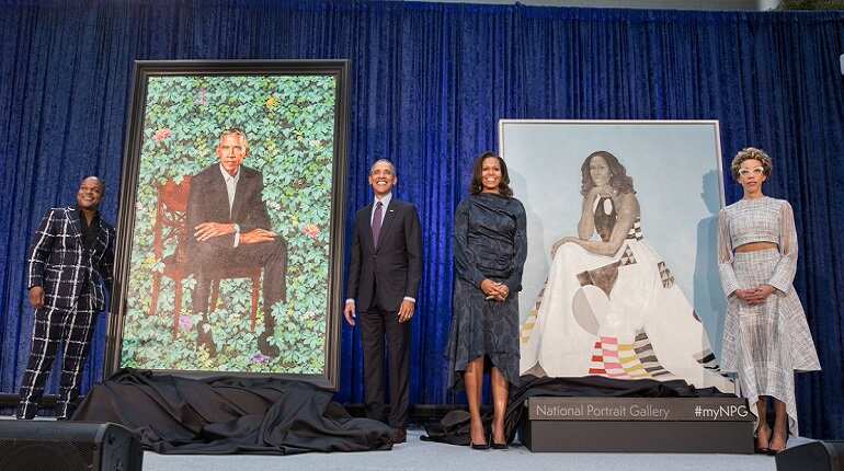 Barack Obama unveils official portraits, jokes about wife's 'hotness'