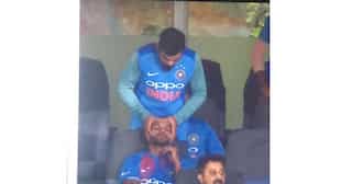 Injured Virat Kohli gives head massage to Shikhar Dhawan during final T-20