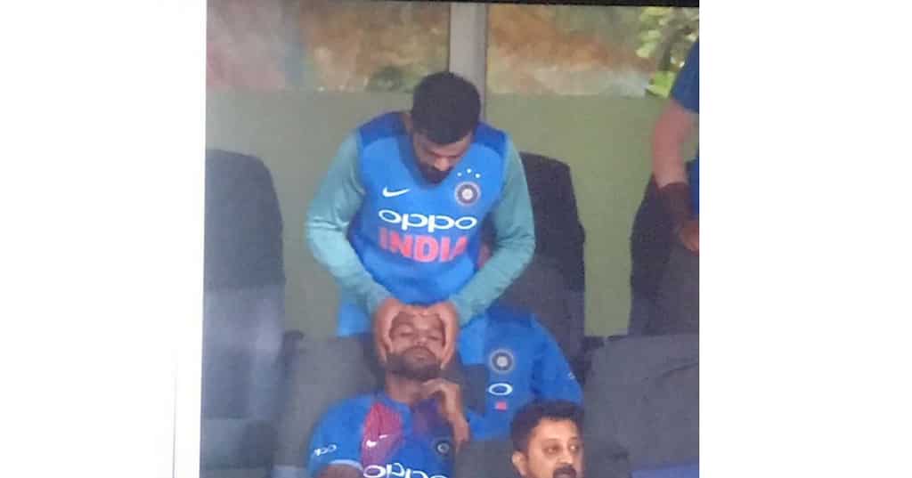 Injured Virat Kohli gives head massage to Shikhar Dhawan during final T-20
