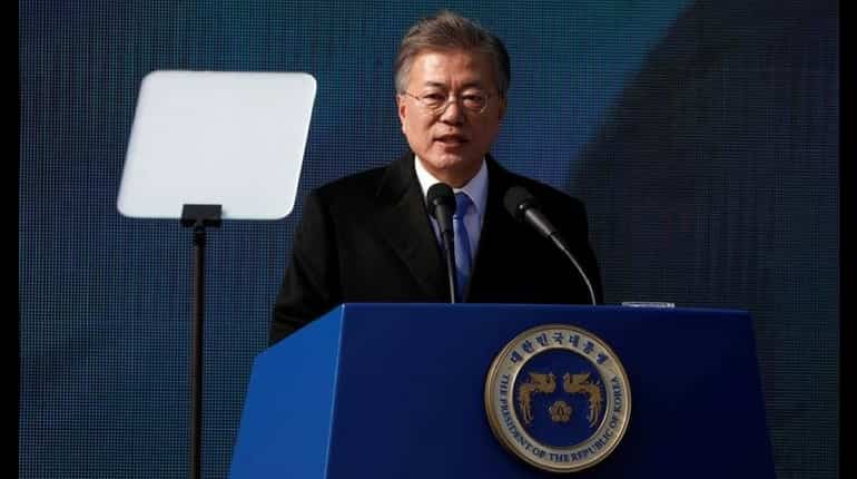 South Korea's Moon says sanctions on North to stay, too early to be optimistic