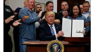 Trump signs sweeping tariffs; Canada, Mexico exempted