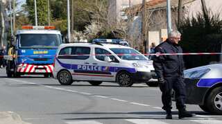 French police officer 'fighting for his life' after hostage swap