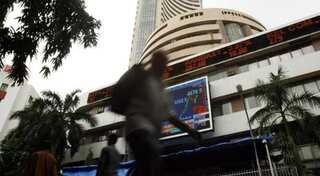 Indices trade flat, Nifty below 10,000 mark