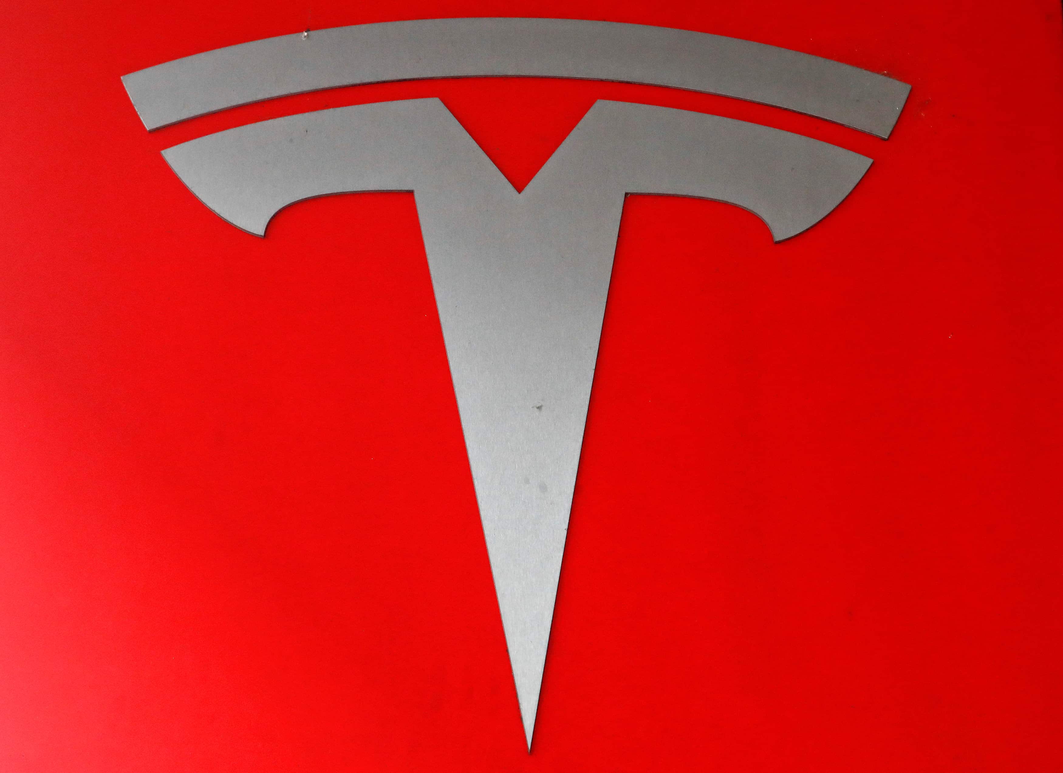 Tesla shares jump as Musk delivers quarterly profit, cash