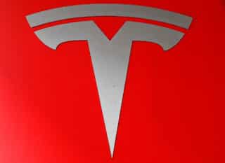 Tesla shares jump as Musk delivers quarterly profit, cash