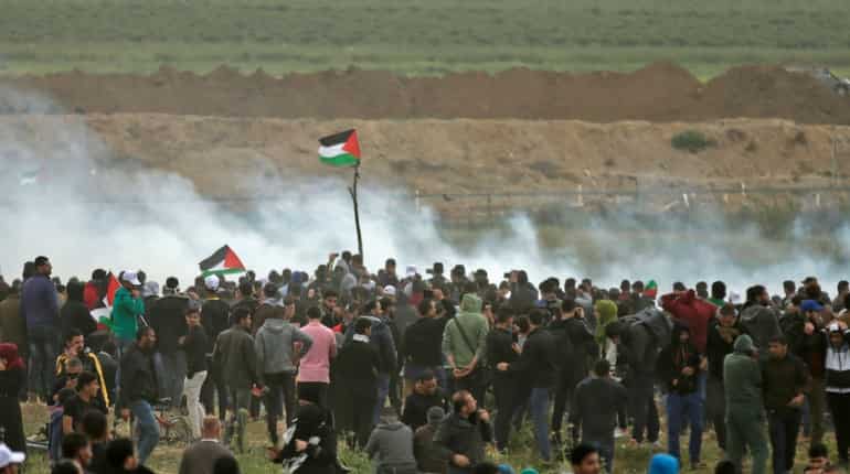 Gaza unrest: At least 12 protestors killed, Israeli drone drops tear gas
