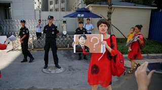 Wife of 'vanished' Chinese lawyer marches for answers