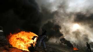 Israeli fire kills Palestinian at Gaza border, with more protests ahead