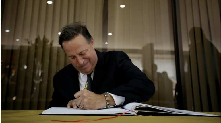 Panama orders Venezuela envoy out, Caracas suspends flights