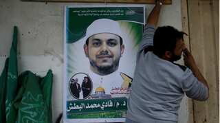 Malaysia releases images of suspects in murder of Palestinian