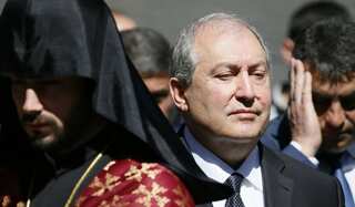 Armenian President calls for talks to resolve crisis as protesters block roads in stand-off with authorities