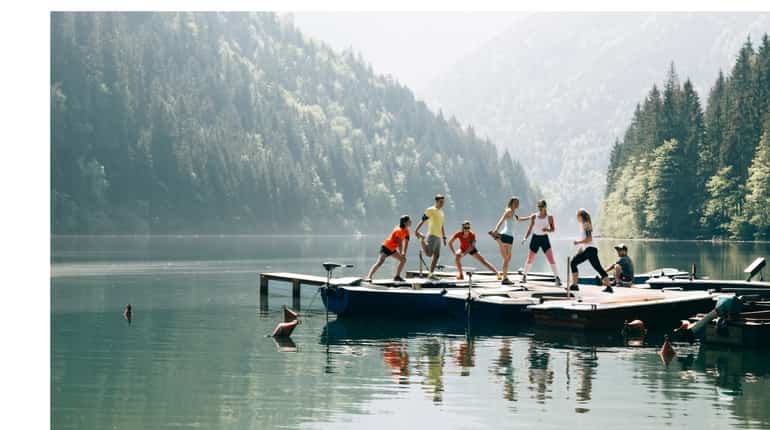 Participants warm up prior to the Wings for Life World Run - App Run around the Grimming, Austria on May 6, 2018