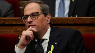 Catalan president forms government without jailed, exiled ministers