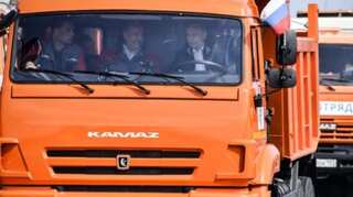 'Trucker' Putin opens Russia bridge link with annexed Crimea