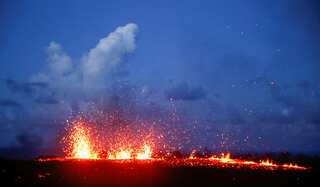 Lava bursts into night sky from Hawaii volcano fissure