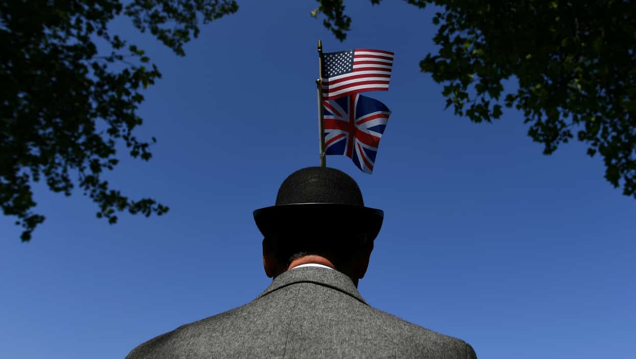A fan wears a bowler hat ahead of the wedding